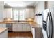 Modern kitchen featuring white cabinets, granite countertops, and stainless steel appliances, a chef's dream at 225 Slipper Shell Ct, Mount Pleasant, SC 29464