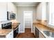 Efficient kitchen layout featuring stainless steel appliances, granite countertops, and a view of the pantry at 225 Slipper Shell Ct, Mount Pleasant, SC 29464