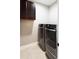 Functional laundry room with dark cabinets and modern front load washing machine and dryer at 225 Slipper Shell Ct, Mount Pleasant, SC 29464