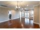 Spacious living room featuring hardwood floors, neutral paint, and ample natural light, perfect for entertaining at 225 Slipper Shell Ct, Mount Pleasant, SC 29464