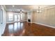Open-concept living room with hardwood floors, a fireplace, and a door to a balcony, offering an inviting space at 225 Slipper Shell Ct, Mount Pleasant, SC 29464