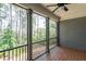 Covered porch area with wood flooring overlooking a lush backyard at 225 Slipper Shell Ct, Mount Pleasant, SC 29464