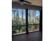 Screened-in porch showcasing serene view of marsh and surrounding trees at 225 Slipper Shell Ct, Mount Pleasant, SC 29464