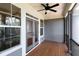 Relaxing screened porch with wood floors, ceiling fan, and view to the outdoors at 225 Slipper Shell Ct, Mount Pleasant, SC 29464