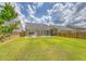 Spacious fenced backyard, with a patio, grill, and lush lawn at 227 Spectrum Rd, Summerville, SC 29486