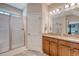 Bright bathroom with granite countertops, double sinks, and a glass-enclosed shower at 227 Spectrum Rd, Summerville, SC 29486