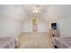 Bright bedroom featuring vaulted ceilings, twin beds, a ceiling fan, and neutral carpeting at 227 Spectrum Rd, Summerville, SC 29486