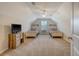 Bright bedroom with vaulted ceilings, two beds, neutral carpet, and a window with plantation shutters at 227 Spectrum Rd, Summerville, SC 29486