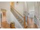 Inviting foyer with hardwood floors, elegant staircase, and decorative accents leading to the home's interior at 227 Spectrum Rd, Summerville, SC 29486