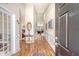 Elegant foyer with high ceilings, hardwood floors, and decorative wall trim at 227 Spectrum Rd, Summerville, SC 29486