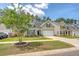 Charming two-story home with well-manicured lawn and landscaped garden at 227 Spectrum Rd, Summerville, SC 29486