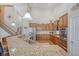 Open-plan kitchen featuring stainless steel appliances, granite countertops, and breakfast bar at 227 Spectrum Rd, Summerville, SC 29486
