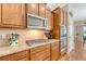 Well-lit kitchen boasting stainless appliances, granite countertops, and plenty of cabinets at 227 Spectrum Rd, Summerville, SC 29486