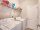 Functional laundry room with a washer, dryer, and wire shelving for storage at 227 Spectrum Rd, Summerville, SC 29486
