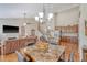Open floor plan showcases dining area, living room, and kitchen with hardwood floors at 227 Spectrum Rd, Summerville, SC 29486