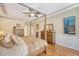 Comfortable bedroom with a canopy bed, ceiling fan, and beautiful hardwood flooring at 227 Spectrum Rd, Summerville, SC 29486