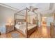 Inviting main bedroom with four-poster bed, tray ceiling, and en-suite bathroom access at 227 Spectrum Rd, Summerville, SC 29486