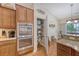 Pantry with well-stocked shelves, granite countertops, and stainless steel appliances at 227 Spectrum Rd, Summerville, SC 29486