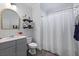 Clean and updated bathroom with vanity, shower, and functional storage shelves at 2292 Skyler Dr, Mount Pleasant, SC 29466