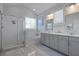 Bathroom showcasing a walk-in shower, soaker tub, and dual sink vanity beneath a vaulted ceiling at 2292 Skyler Dr, Mount Pleasant, SC 29466