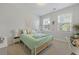 Well-lit bedroom boasts two windows and stylish decor and surf board accent at 2292 Skyler Dr, Mount Pleasant, SC 29466