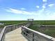 Scenic boardwalk view with lush marshland and blue skies, showcasing the natural beauty of the surrounding landscape at 2292 Skyler Dr, Mount Pleasant, SC 29466