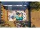 Aerial view of a private backyard with a pool, lounge seating, and a fire pit area at 231 Bayview Dr, Mount Pleasant, SC 29464