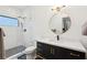 Stylish bathroom with a glass shower, and contrasting black and white tiles at 231 Bayview Dr, Mount Pleasant, SC 29464