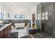 Modern bathroom with soaking tub, walk-in shower, double vanities, and sleek tile flooring at 231 Bayview Dr, Mount Pleasant, SC 29464