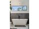 Freestanding bathtub next to a large window offering a view of nature, with dark stone accents at 231 Bayview Dr, Mount Pleasant, SC 29464