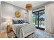 Bedroom with stylish furnishings and decor, leading to a private balcony with outdoor views at 231 Bayview Dr, Mount Pleasant, SC 29464