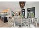 Dining area with modern chandelier and view to the rest of this open-concept house at 231 Bayview Dr, Mount Pleasant, SC 29464