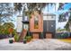 Striking modern home featuring mixed siding, a metal roof, a two-car garage, and a landscaped entrance at 231 Bayview Dr, Mount Pleasant, SC 29464