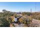 Stunning aerial view of a modern home near bridge featuring unique architecture, ample parking, and scenic backdrop at 231 Bayview Dr, Mount Pleasant, SC 29464