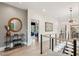 Hallway with hardwood floors, decorative mirror, stylish console table, and view of bedrooms at 231 Bayview Dr, Mount Pleasant, SC 29464