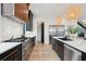 Kitchen with stainless appliances, dark cabinets with gold hardware, and white countertops at 231 Bayview Dr, Mount Pleasant, SC 29464