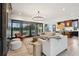 Open living room with light wood floors, modern furnishings, and sliding glass doors to the patio at 231 Bayview Dr, Mount Pleasant, SC 29464