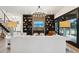 An open living space featuring a stone accent wall with built-in shelving and a fireplace at 231 Bayview Dr, Mount Pleasant, SC 29464