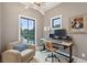 Bright office with large windows, modern light fixture, comfortable chair, and functional desk space at 231 Bayview Dr, Mount Pleasant, SC 29464