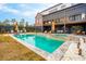 Backyard pool and patio area features luxurious in-ground pool, hot tub, and lounging area at 231 Bayview Dr, Mount Pleasant, SC 29464