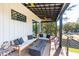 Spacious porch features a sleek fireplace and comfortable seating with scenic backyard views at 231 Bayview Dr, Mount Pleasant, SC 29464