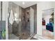 Sleek glass-enclosed shower with gray tile and a view into the stylishly decorated bedroom at 231 Bayview Dr, Mount Pleasant, SC 29464