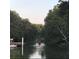 People enjoying a leisurely paddle in kayaks on a serene waterway surrounded by lush trees at 231 Bayview Dr, Mount Pleasant, SC 29464