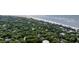 Picturesque coastal neighborhood, lush vegetation, and the calming backdrop of the ocean at 24 Beachwood West, Isle of Palms, SC 29451
