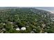 Lush neighborhood with tree coverage, nearby water towers, and appealing residential homes at 24 Beachwood West, Isle of Palms, SC 29451