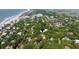 Beautiful aerial view of a home among trees, near the beach, highlighting the lush surrounding landscape at 24 Beachwood West, Isle of Palms, SC 29451