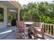 Outdoor back deck space featuring a dining table and comfortable seating arrangement at 24 Beachwood West, Isle of Palms, SC 29451