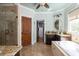 Luxurious bathroom with a soaking tub, walk-in shower, and stylish vanity with granite countertops at 24 Beachwood West, Isle of Palms, SC 29451