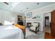 Relaxing bedroom featuring a fireplace, ample natural light, and stylish decor at 24 Beachwood West, Isle of Palms, SC 29451