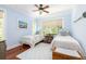 Light and airy bedroom with hardwood floors and blue painted walls at 24 Beachwood West, Isle of Palms, SC 29451
